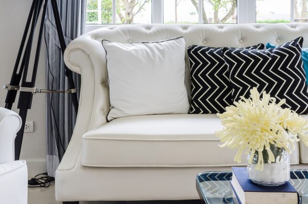 white couch with pillows 